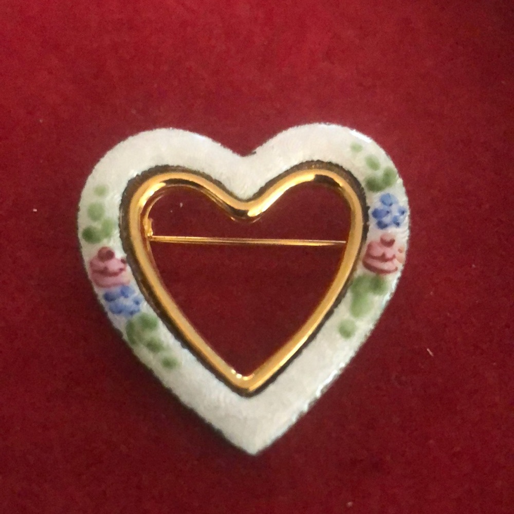 Gold trimmed white enameled pin with hand painted blue and pink flowers.